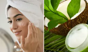 Mujer aplicándose crema en la cara, junto a un coco y un tarro de aceite de coco para la cara.